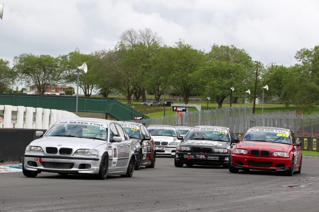 BMW cars racing on a track during an E46 class race in New Zealand